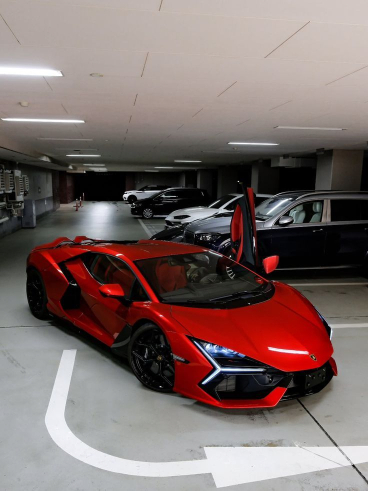 Red Lamborghini in a parking garage